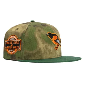 New Era 59Fifty Water Color Camo Baltimore Orioles 20th Anniversary Stadium Patch Hat - Camo. Green